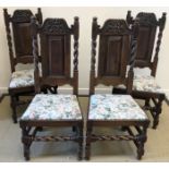 A set of four 19th Century oak panel back dining chairs in the 17th Century style with upholstered