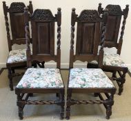 A set of four 19th Century oak panel back dining chairs in the 17th Century style with upholstered