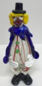 A collection of four Murano glass style clown ornaments, the tallest 27.