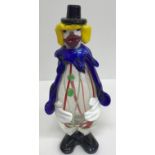 A collection of four Murano glass style clown ornaments, the tallest 27.