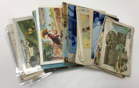 A small collection of vintage postcards and a collection of advertising and Royal commemorative