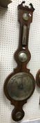A Victorian rosewood cased banjo barometer thermometer with silvered dial 110cm length