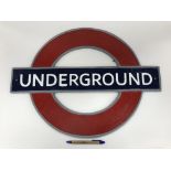 A modern cast metal sign inscribed "Underground", 59.