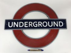 A modern cast metal sign inscribed "Underground", 59.