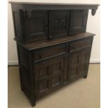 A 20th Century oak court cupboard in the 18th Century manner,