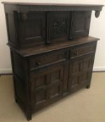 A 20th Century oak court cupboard in the 18th Century manner,