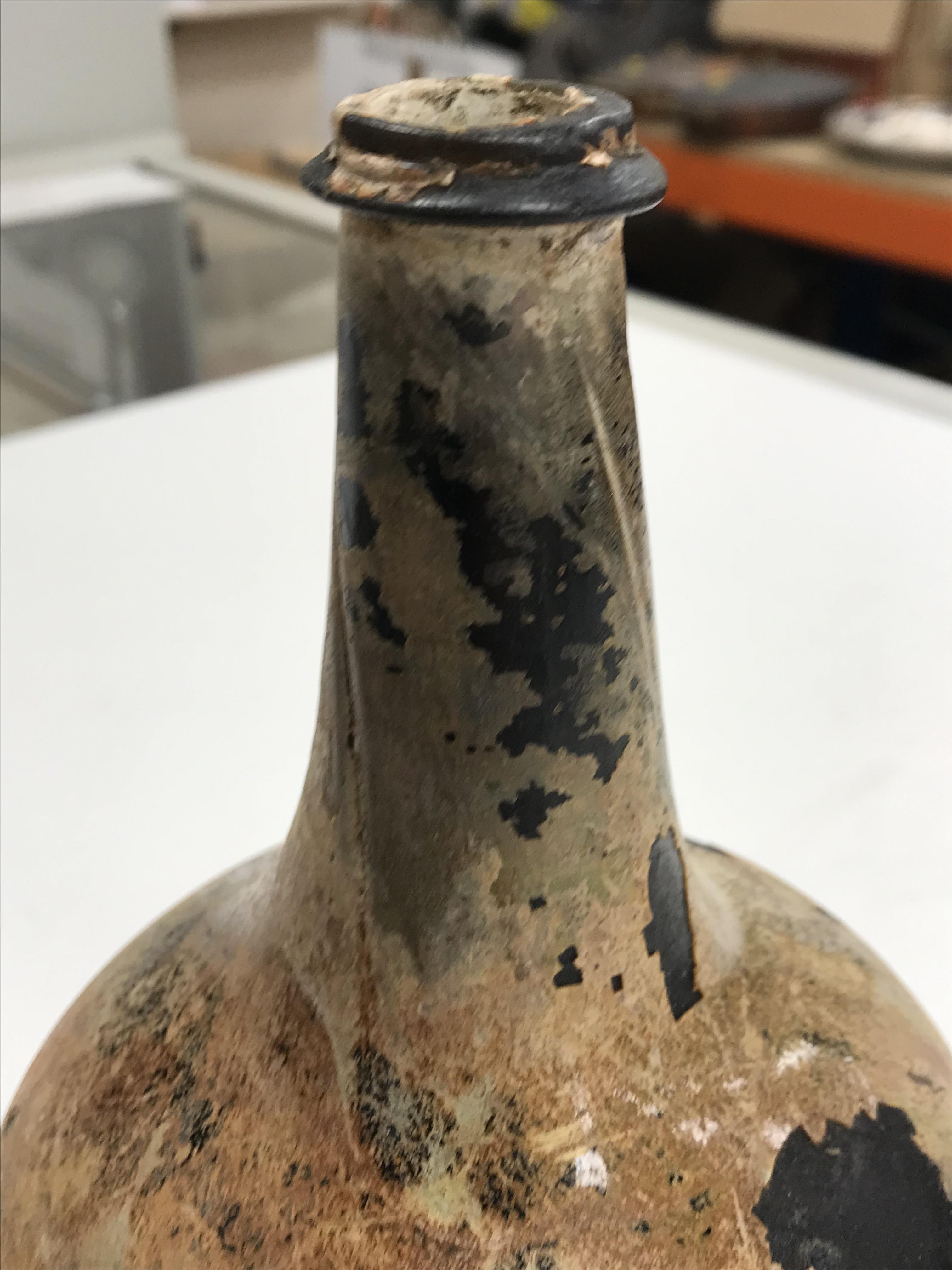 A mid 18th Century English black glass mallet-shaped wine bottle, - Image 7 of 33