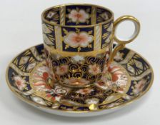 A set of six Royal Crown Derby Imari pattern coffee cups and saucers together with a matching sugar