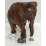 Three boxes of assorted elephant ornaments to include wooden and china examples