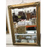 A modern gilt framed wall mirror with bevel edged rectangular plate, 76 cm wide x 107 cm high,