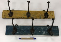 Two triple coat hooks in the vintage style, one in mustard 46 cm long,