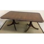 A reproduction mahogany D end twin pedestal dining table, with three leaves (seats 12),