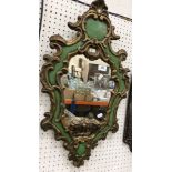 An early 19th Century style wall mirror with C scrolling frame and gilt and green painted