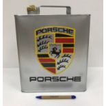 A modern rectangular petrol can inscribed "Porsche",