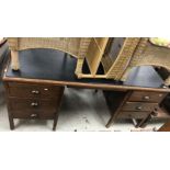 A mid 20th Century oak double pedestal desk,