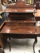 An Edwardian rosewood and cross-banded ladies writing table with tiered superstructure and two