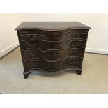 A modern mahogany serpentine fronted bachelor's chest in the George III taste,