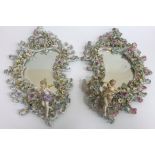 A pair of German porcelain Rococo style mirrors in the Sitzendorf manner,