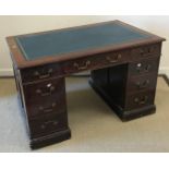 A mahogany double pedestal kneehole desk in the Georgian style,