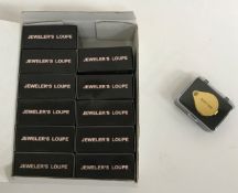 A collection of twelve 30mm x 21mm jewellers' loupes