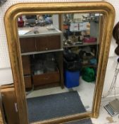 A 19th Century style giltwood wall mirror with foliate decoration and beaded edge,