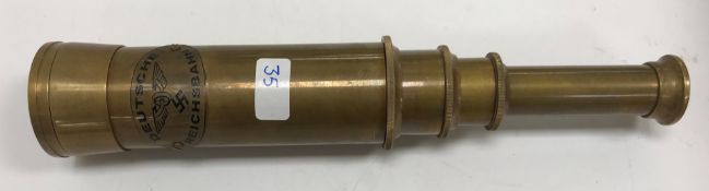 A modern brass telescope bearing label inscribed "Deutsche Reichsbahn",