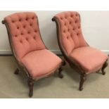 A pair of Victorian rosewood framed salon / slipper chairs with salmon pink upholstery,