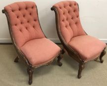 A pair of Victorian rosewood framed salon / slipper chairs with salmon pink upholstery,