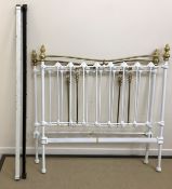 A circa 1900 brass and iron double bedstead,