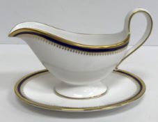 A Spode Knightsbridge blue and gilt decorated part dinner and tea service comprising tea pot,