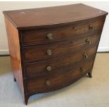 A Regency mahogany bow fronted chest of four long graduated drawers with moulded edges and brass