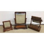 Two Victorian mahogany framed dressing mirrors, both with serpentine bases and rectangular plates,