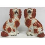 A pair of Staffordshire Spaniel figures, 20 cm high,