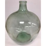 A large glass carboy 54 cm high together with a further large glass vase with writhen type