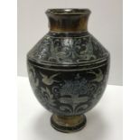 A late 19th Century Martin Brothers pottery vase with Classical cherubic and garland decoration,