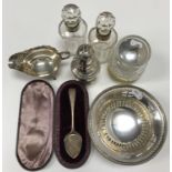 A collection of silver to include a pierced bonbon dish of circular form, raised on circular base,