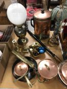 A collection of metal wares to include a pair of brass candlesticks, a brass chamber stick,