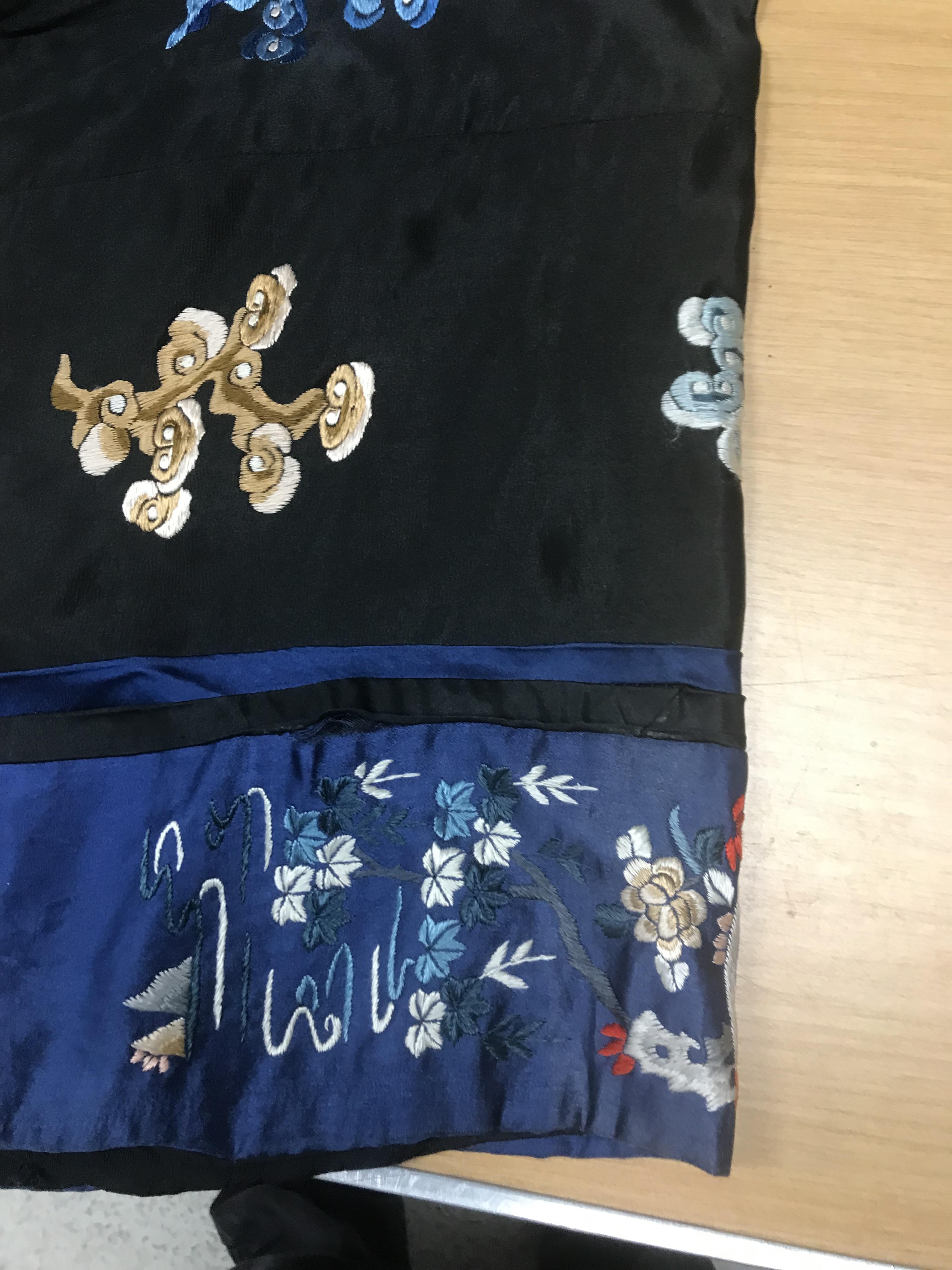 A Chinese silk jacket with crane and wave decoration on a black ground - Image 4 of 8