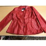 A Celine of Paris leather coat with hide panels printed with stylised big cat pattern, size 42,