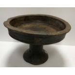 An 18th Century carved treenware pedestal bowl with slightly flared rim raised on a tapered foot 37