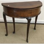 A George III mahogany tea table of demi-lune form,