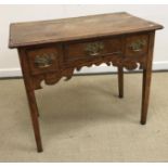 A late 18th Century oak lowboy,