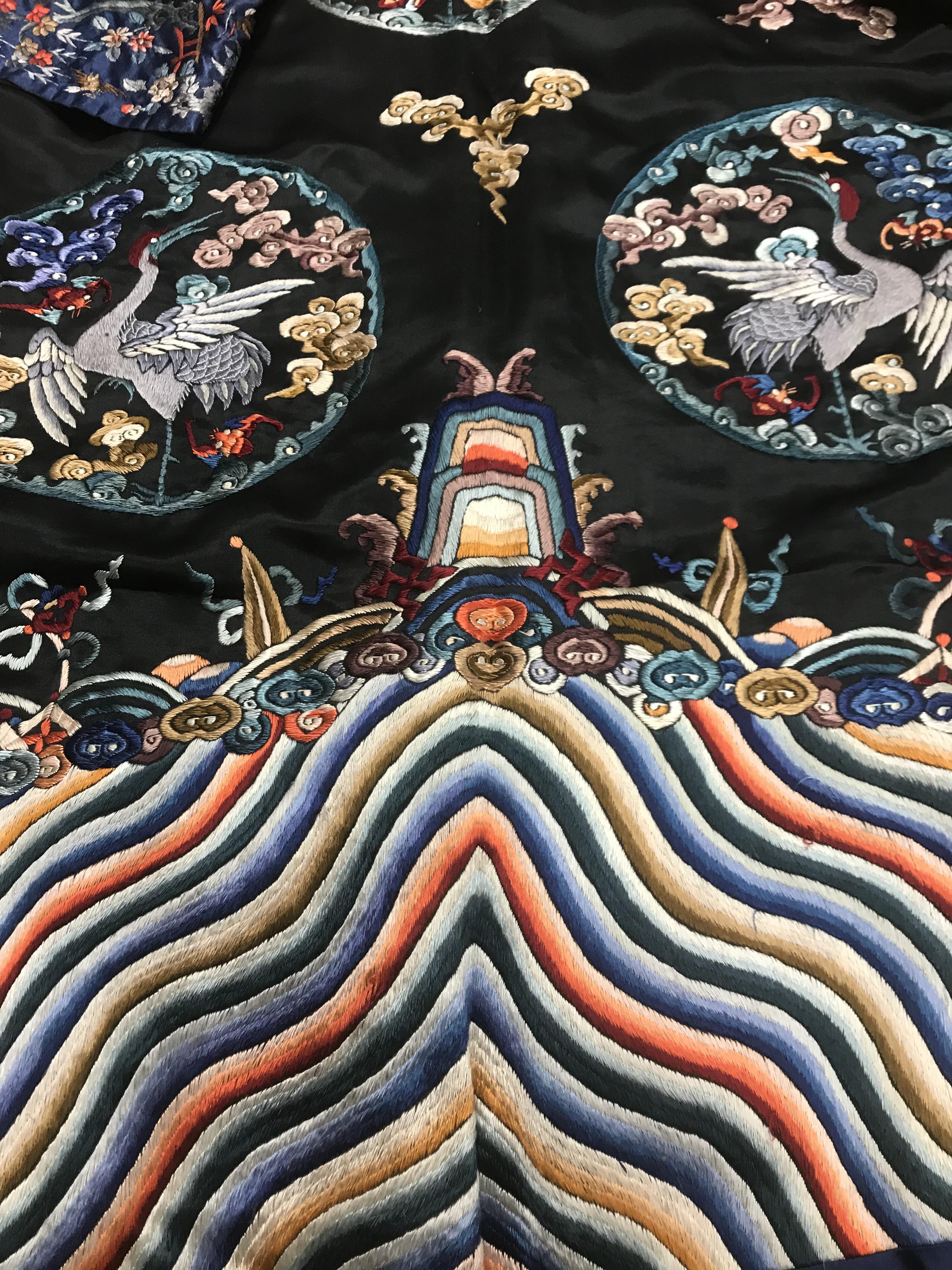 A Chinese silk jacket with crane and wave decoration on a black ground - Image 8 of 8