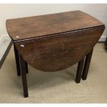 A 19th Century mahogany Pembroke style drop-leaf dining table with single end drawer on square