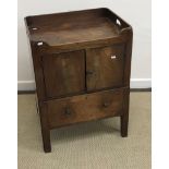 A George III mahogany tray top night table with two cupboard doors, over a pull-out commode drawer,