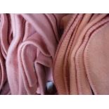 Two single wool blankets in pink, together with a single wool blanket in coral,