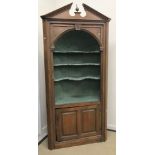 A 19th Century pine barrel back corner cupboard,