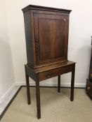 A 19th Century North Country oak cupboard on stand,