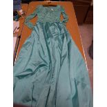 A 1960s Camilla Middleton aquamarine satin evening gown with lace overlay to bodice and sleeves