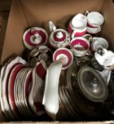 A box containing an Old Royal China part tea service with puce and floral decoration and a small